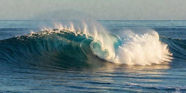 Panoramic view of peeling surf wave